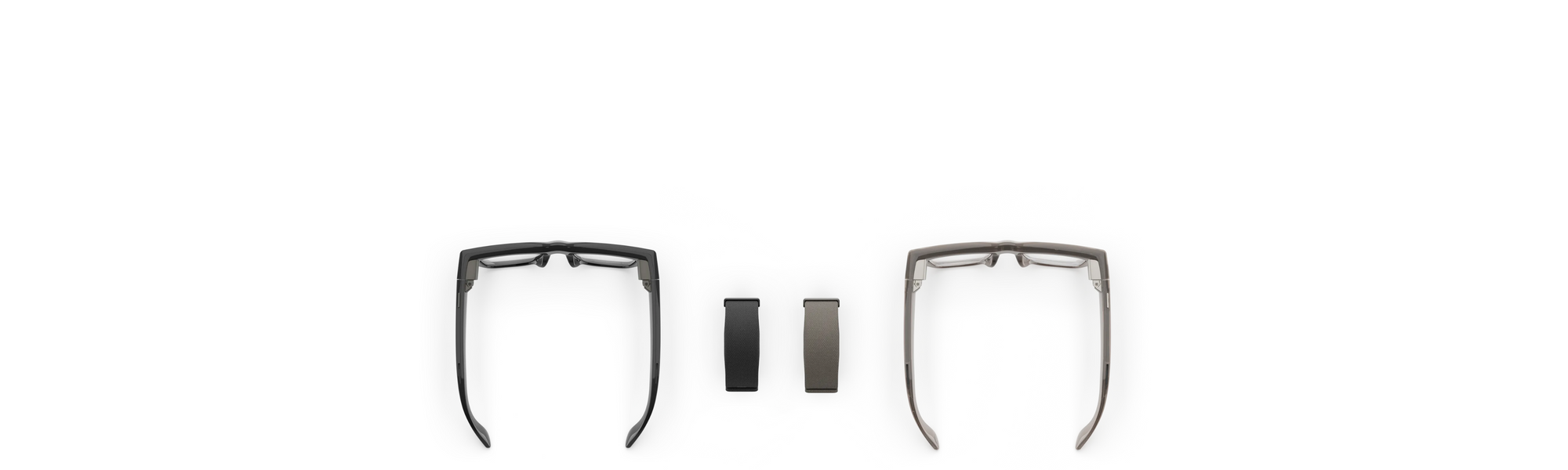 A picture of 2 pairs of Ray-Ban Meta Display smart glasses and their respective neural writstbands, facing each other in the center of the image